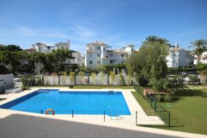 The swimming pool at or close to La Reserva Puerto Banus