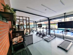 a gym with cardio equipment in a building at Panorama Deluxe Aparthotel in Cluj-Napoca