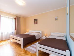 Postel nebo postele na pokoji v ubytování Apartment Eva Funtana