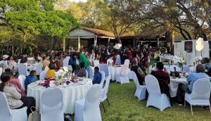 a group of people sitting at tables at an event at The Venue Country Hotel & Spa in Hartbeespoort +37 photos