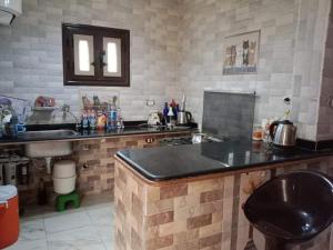 a kitchen with a sink and a counter top at Marsa Matrouh in Marsa Matruh
