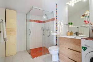 a bathroom with a shower and a toilet and a sink at Loft El Til-ler in Bellvei del Penedes