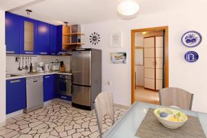 Kuchyňa alebo kuchynka v ubytovaní Apartments Mel