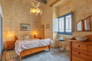 Rúm í herbergi á Casa Felini - Homestay