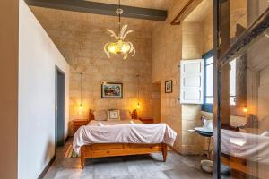 Rúm í herbergi á Casa Felini - Homestay