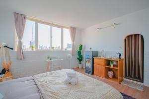 Postel nebo postele na pokoji v ubytování La Casa Di Dicembre HCMC