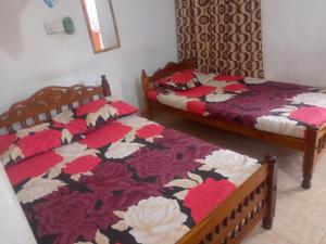 Ένα ή περισσότερα κρεβάτια σε δωμάτιο στο Kunam Beach Rest Inn