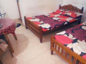 Ένα ή περισσότερα κρεβάτια σε δωμάτιο στο Kunam Beach Rest Inn