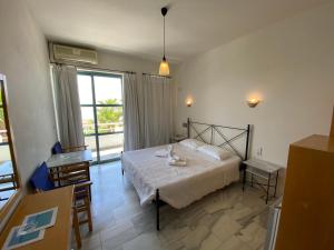 Posteľ alebo postele v izbe v ubytovaní Hotel Plakures