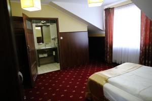 Posteľ alebo postele v izbe v ubytovaní Hotel Kalchem
