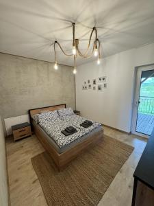 a bedroom with a bed in a room at Apart Home Bieszczady in Uherce Mineralne (7)