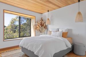 Ένα ή περισσότερα κρεβάτια σε δωμάτιο στο Stunning Trevallyn Retreat