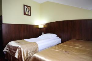 Posteľ alebo postele v izbe v ubytovaní Hotel Kalchem