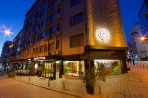 a building with a clock on the side of it at Hotel Eyfel in Istanbul