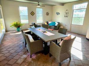 a dining room with a table and chairs at Kangaroo Island Seabright House in Kingscote