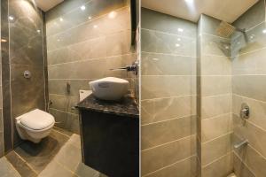 a bathroom with a toilet and a glass shower at FabExpress 56 Amritsar in Amritsar