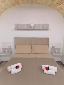 Un pat sau paturi într-o cameră la Aurosa Vacanze