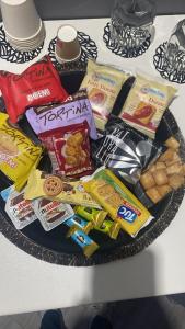 a plate filled with different types of snacks on a table at Le Suite Piazza Nuova in Foggia