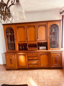 a large wooden cabinet in a room at Vila Romaneasca in Corbola