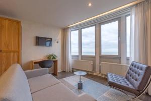 TV a/nebo společenská místnost v ubytování Hotel de Baak Seaside