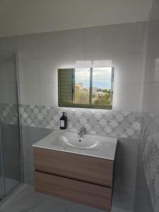 a bathroom with a sink and a window at FONDO VERSACE in Reggio di Calabria +47 photos