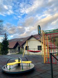 a playground with a slide and a slidesktop at VitaPark Carpaty in Zhdenievo