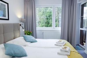 Łóżko lub łóżka w pokoju w obiekcie Hotel Rezydencja AS & Spa-Najwyżej w Karpaczu