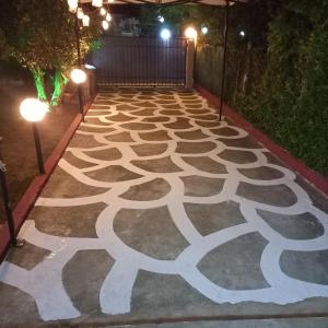a carpeted walkway with lights on it at night at SELO APARTMENTS in Nea Kalikratia