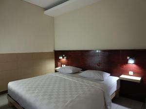 Postel nebo postele na pokoji v ubytování Keola Hotel Legian