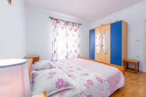 Posteľ alebo postele v izbe v ubytovaní Holiday House Anica