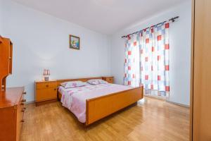Posteľ alebo postele v izbe v ubytovaní Holiday House Anica