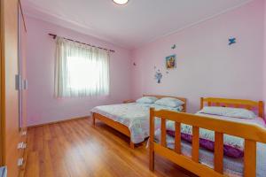 Posteľ alebo postele v izbe v ubytovaní Holiday House Anica