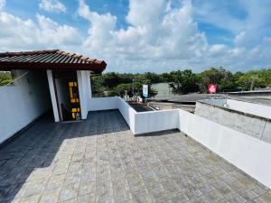 a building with a walkway on the side of it at Serendib Villa Mirissa in Mirissa
