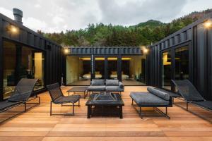 a patio with chairs and a table on a building at G,O,A,T - Vacation STAY 13909v in Tsuru 