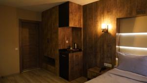 Postel nebo postele na pokoji v ubytování Aktas Hotel