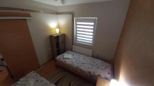 Postel nebo postele na pokoji v ubytování Apartman Ivona