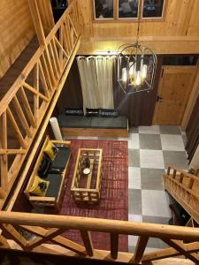 an overhead view of a living room in a cabin at Soho house in Jibhi