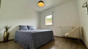 Postel nebo postele na pokoji v ubytování La maison de Louise à 10 min Genève + 4 fotografie