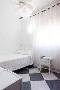 Postel nebo postele na pokoji v ubytování Hostal Restaurante La Giralda