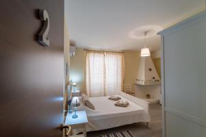 Postel nebo postele na pokoji v ubytování Domo Papiros B&B