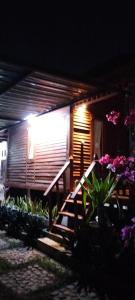 a building with a light on the side of it at Bogenvil villa in Tanjung
