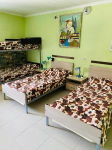 a room with three beds in a room at Lovely Goris in Goris