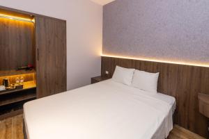 מיטה או מיטות בחדר ב-Việt Hoa Hotel