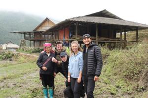 a group of people standing in front of a house at Sapa's Soul 2 in Sa Pa