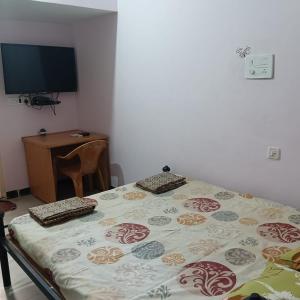 Posteľ alebo postele v izbe v ubytovaní Anjani Suta Home stay