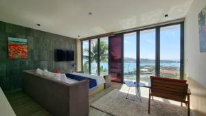 a bedroom with a bed and a view of the ocean at Ocean Beach Villa Nha Trang in Nha Trang