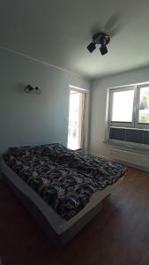 Posteľ alebo postele v izbe v ubytovaní APARTAMENT PRZYSTAŃ