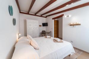Postel nebo postele na pokoji v ubytování Domo Papiros B&B