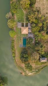 an aerial view of a house on an island in the water at Khla Lodge in Kampot