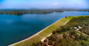 an island in the middle of a large body of water at Waraka - Udawalawe by Thema Collection in Udawalawe